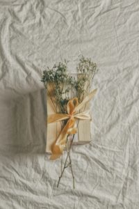 Image of gift with floral arrangement